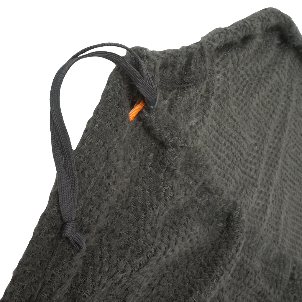 Close-up of a textured gray fabric with a black drawstring and orange tag.