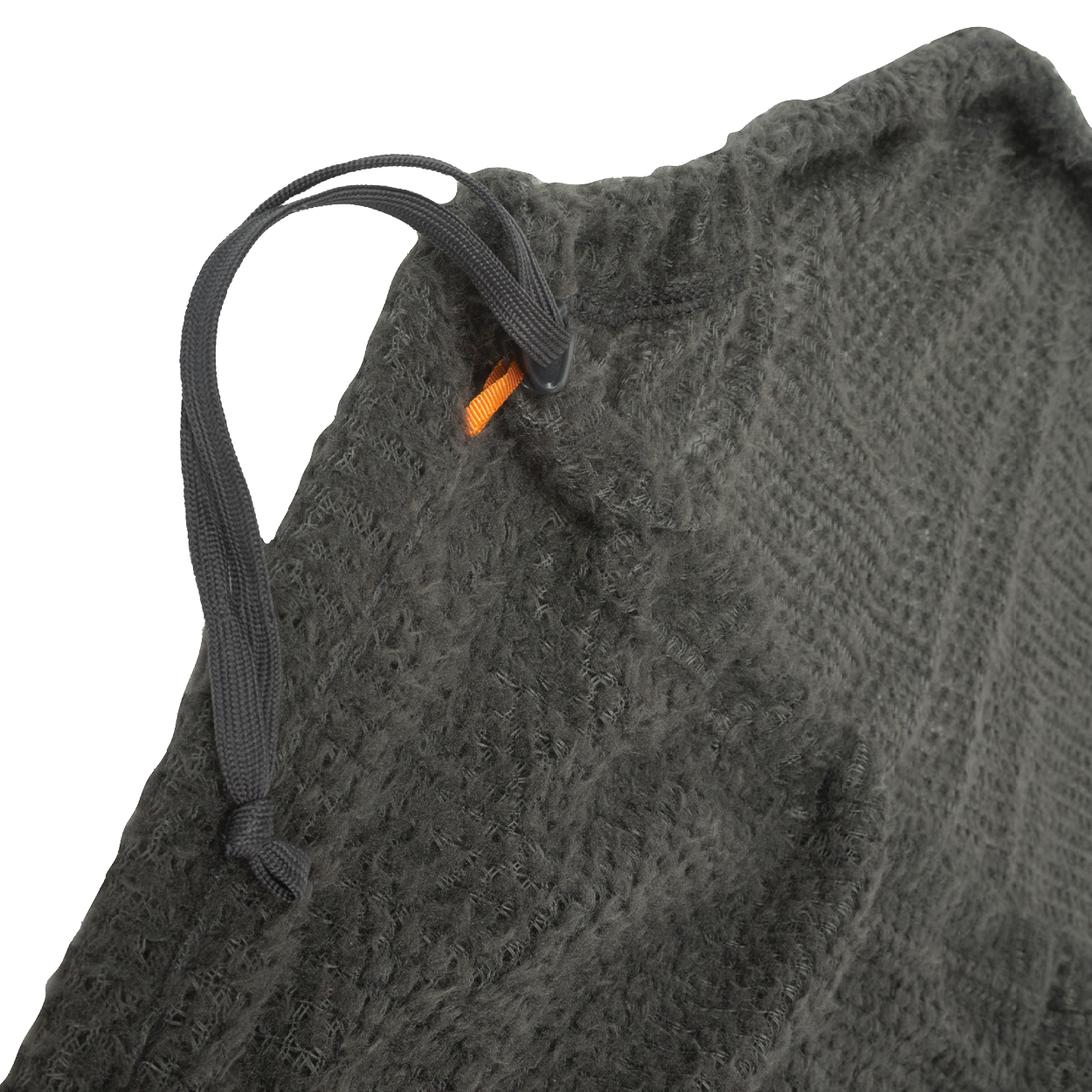 Close-up of a textured gray fabric with a black drawstring and orange tag.