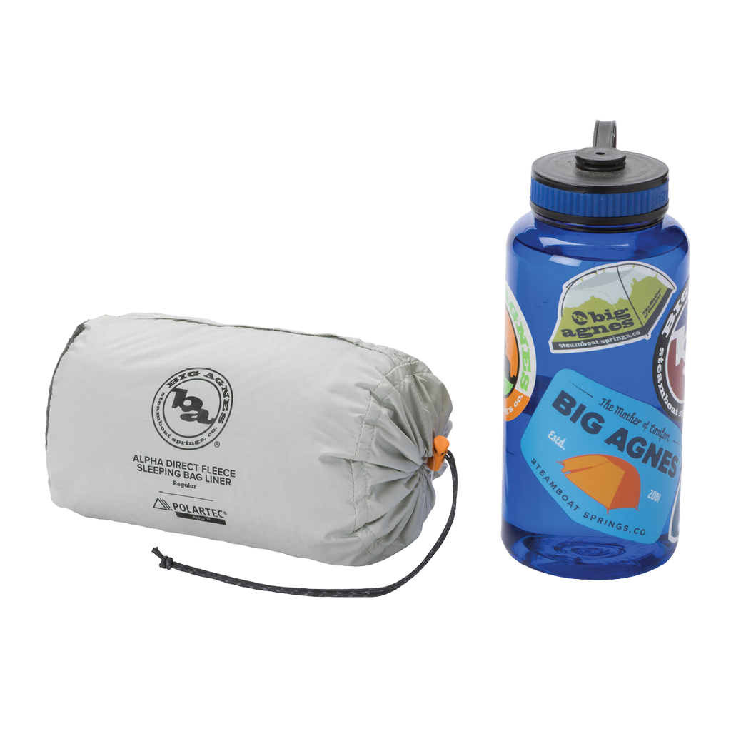 Sleeping bag liner and water bottle with Big Agnes branding on a white background