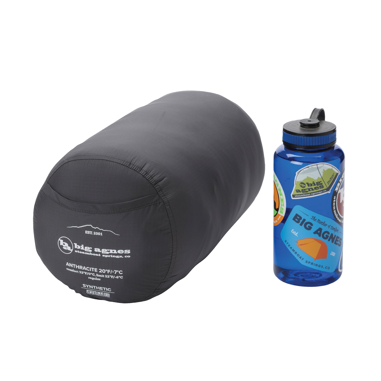 A Big Agnes Anthracite 20° gray mummy sleeping bag in its compression sack sits beside a blue sticker-covered reusable water bottle, both on a white background.