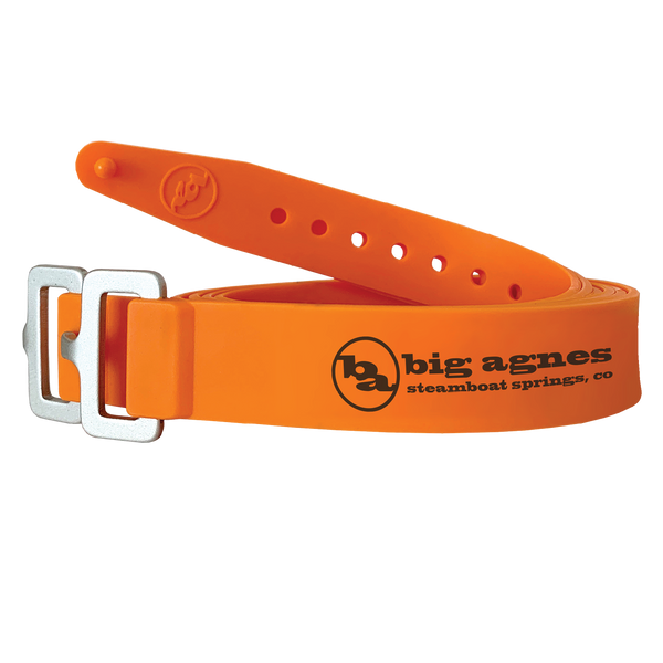 Orange belt with metal buckle and Big Agnes Returns logo on a white background
