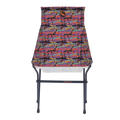 The Big Agnes Big Six Camp Chair - Alpenglow is a lightweight, packable camp chair with a black metal frame and a colorful seat featuring a vibrant abstract mountain landscape in red, purple, blue, and orange.