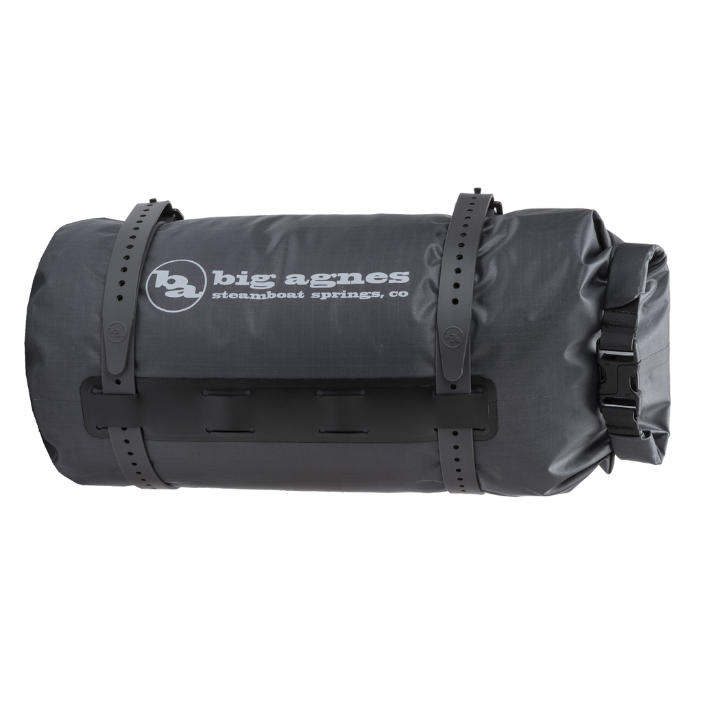 Black roll-top bag with 'Big Agnes Returns' logo on a white background