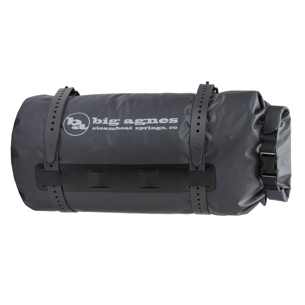 Black roll-top bag with 'Big Agnes Returns' logo on a white background