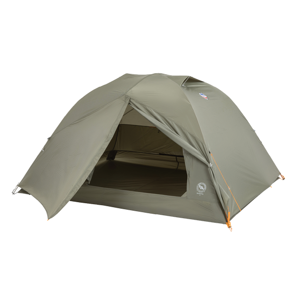 The Big Agnes Returns Blacktail 3 - Vetiver is a green, dome-shaped, lightweight backpacking tent with orange guy lines. Shown with its open entrance revealing the interior floor and mesh door, it’s set against a plain white background.