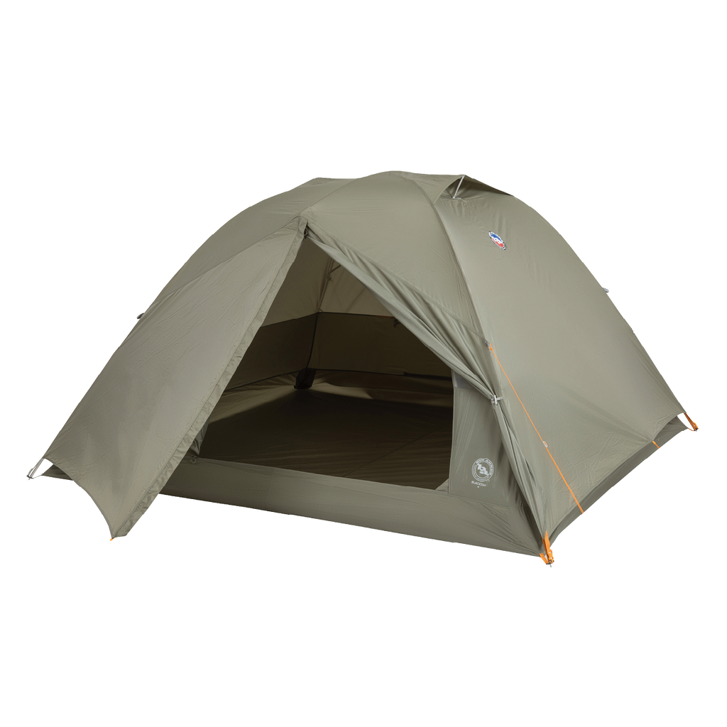 The Big Agnes Returns Blacktail 4 - Vetiver is a green, dome-shaped lightweight backpacking tent with an open front door showing the interior, orange corner guylines, and is set up against a plain white background.