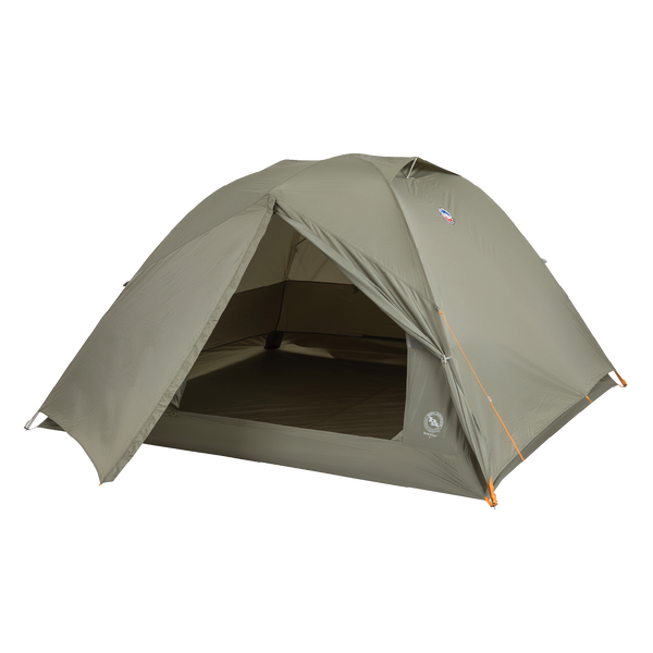 The Big Agnes Returns Blacktail 4 - Vetiver is a green, dome-shaped lightweight backpacking tent with an open front door showing the interior, orange corner guylines, and is set up against a plain white background.