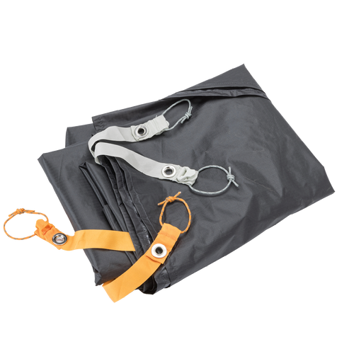 Folded gray Copper Spur UL1 Bikepack Footprint with orange and silver straps on a white background