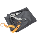 Folded gray Copper Spur UL1 Bikepack Footprint with orange and silver straps on a white background