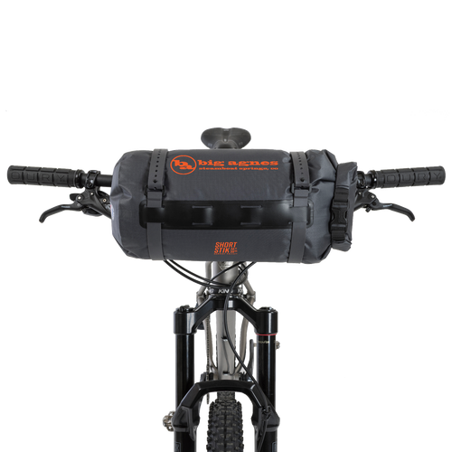 Bicycle handlebar with a black bag and visible branding on a white background