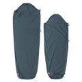 Two dark blue Big Agnes Cotton Sleeping Bag Liners are laid flat. The left is rectangular with a hood; the right is a tapered mummy style. Both feature a small logo at the bottom and are ideal for travel.