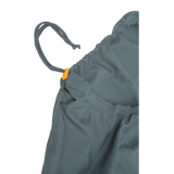 Close-up of the Big Agnes Cotton Sleeping Bag Liner—gray fabric bag with an orange plastic toggle, ideal as a travel companion or for storing your sleeping bag, with the drawstring partially pulled through its edge channel.