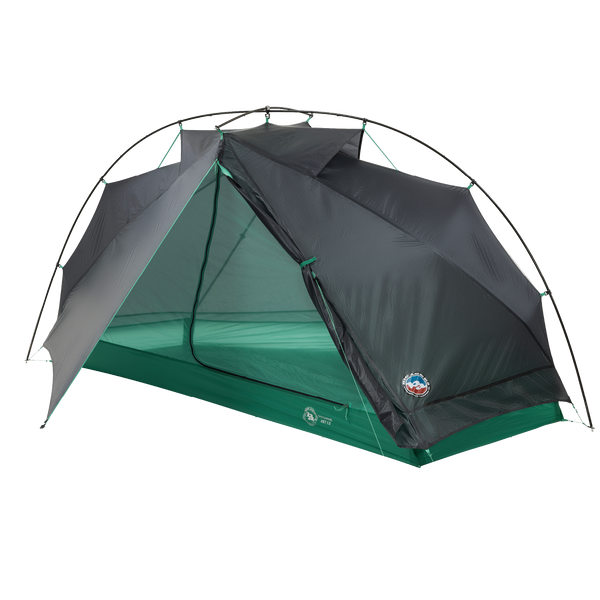 The Big Agnes Returns Pitchpine VST 1.5, a green and gray dome-shaped tent with a mesh door, is displayed partially open on a white background. Made from Hyperbead fabric, this ultralight shelter is ideal for your next adventure.