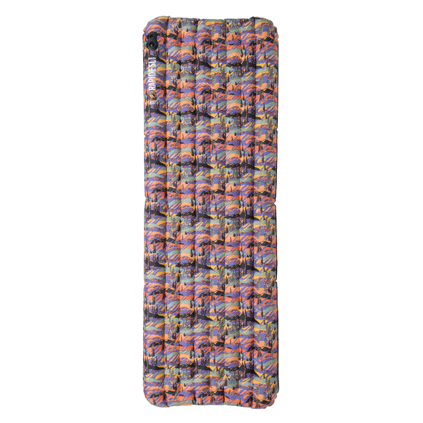 Multicolored inflatable camping pad on a white background