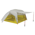 The Big Agnes Returns Salt Creek 3, shown in yellow and gray on a white background, is a backpacking tent with a spacious interior, large rainfly with extended awning supported by two trekking poles, and mesh windows for panoramic views.