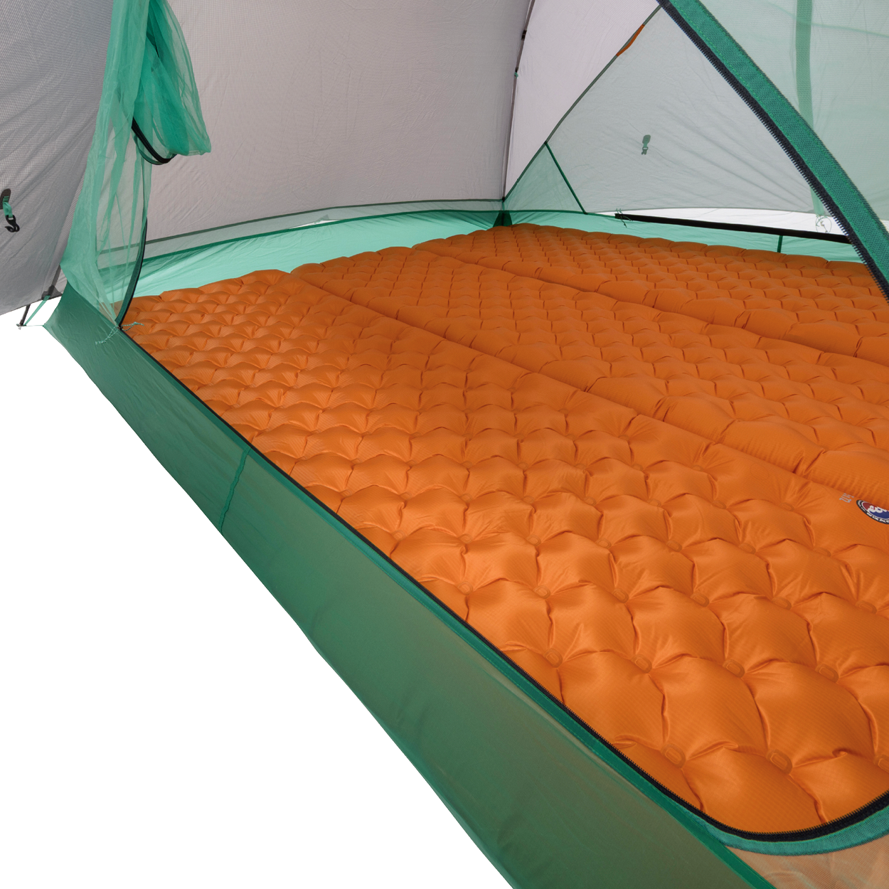 Orange inflatable sleeping pads are arranged side by side inside a green Big Agnes Sarvis VST 2 tent, covering the floor and offering cushioning for campers in this ultralight shelter.