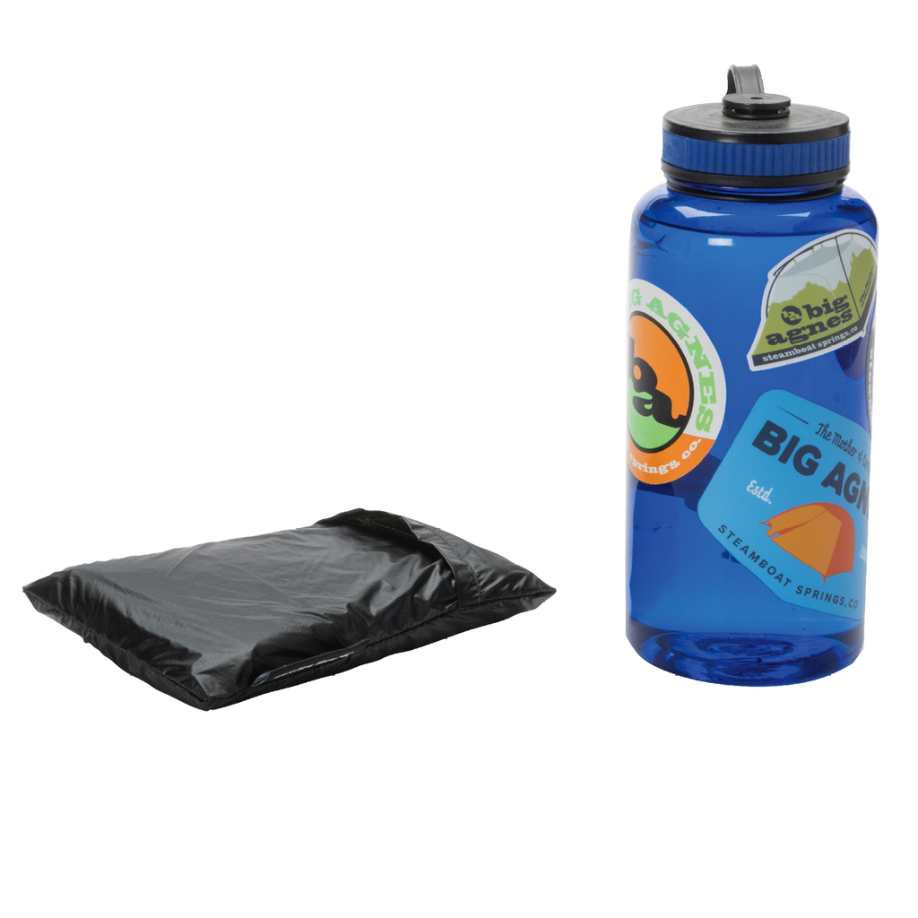 A blue water bottle with colorful stickers stands upright beside a folded black Sarvis VST 3 Footprint by Big Agnes, both set against a plain white background.