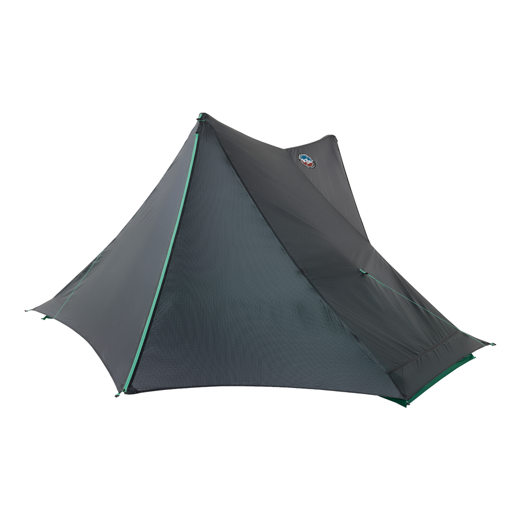 The Big Agnes Returns String Ridge VST 1.5 is a dark gray, single-pole, pyramid-shaped ultralight tent with green-trimmed seams that stands out against a plain white background.