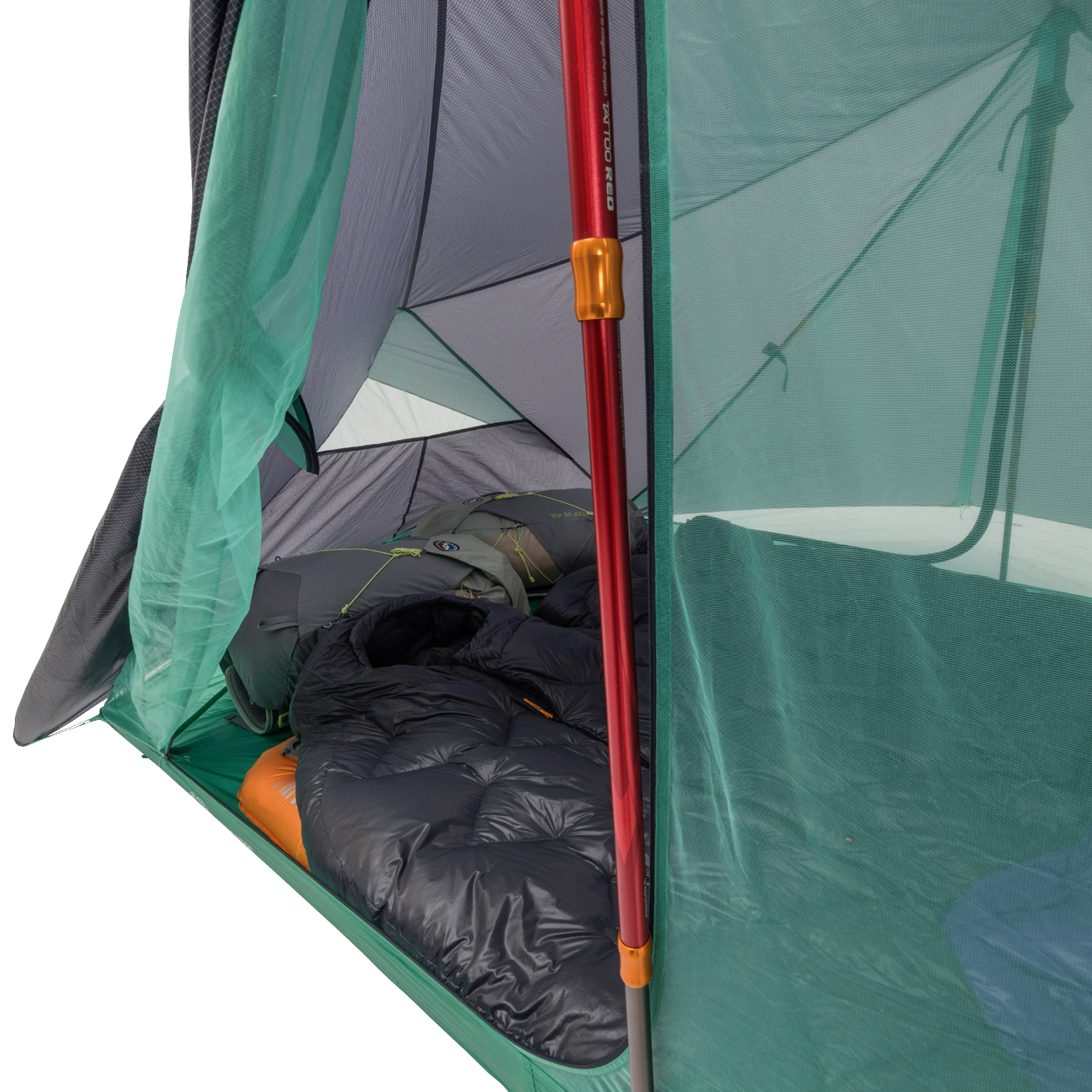 Camping tent with a sleeping bag inside, showing the interior setup.