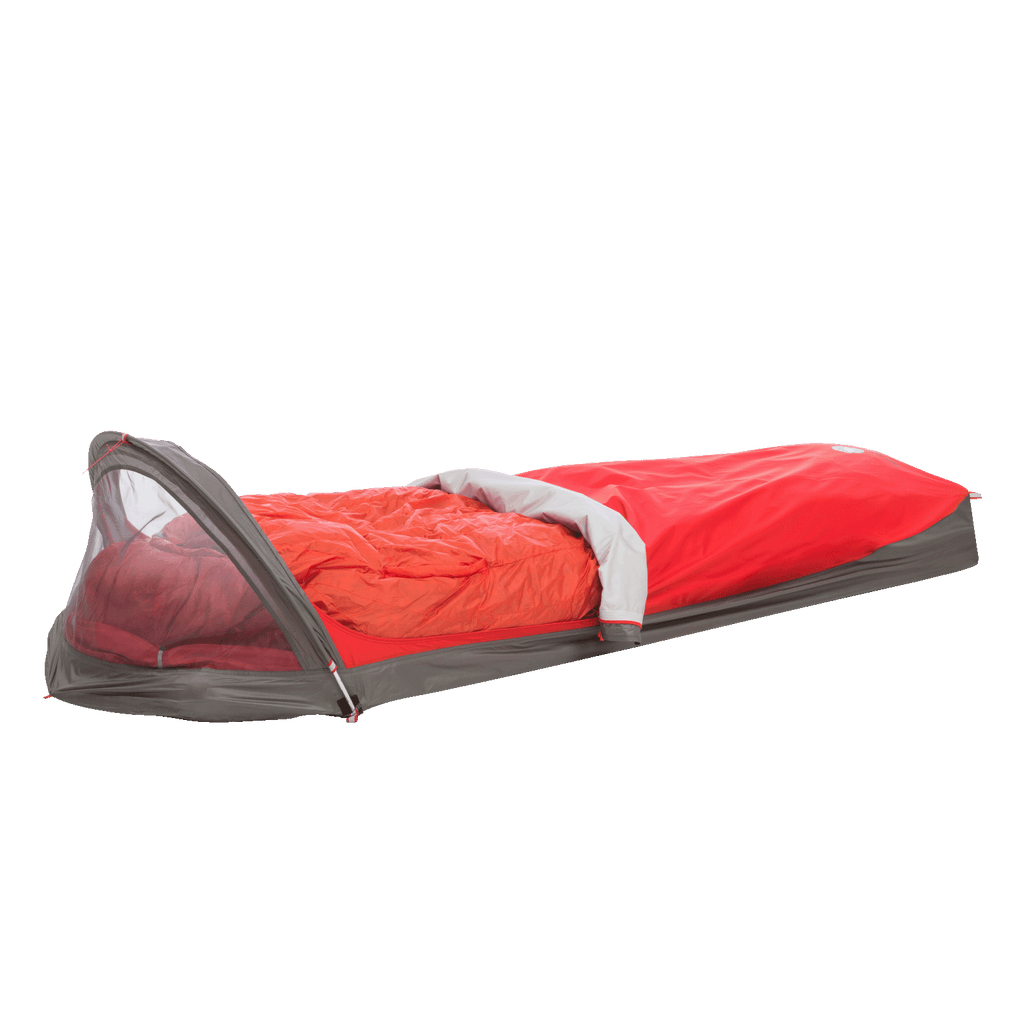 The Big Agnes Returns Three Wire Hooped Bivy, shown in red and gray with a mesh-covered head area and an orange sleeping bag inside, is designed for outdoor camping and provides reliable four-season protection.