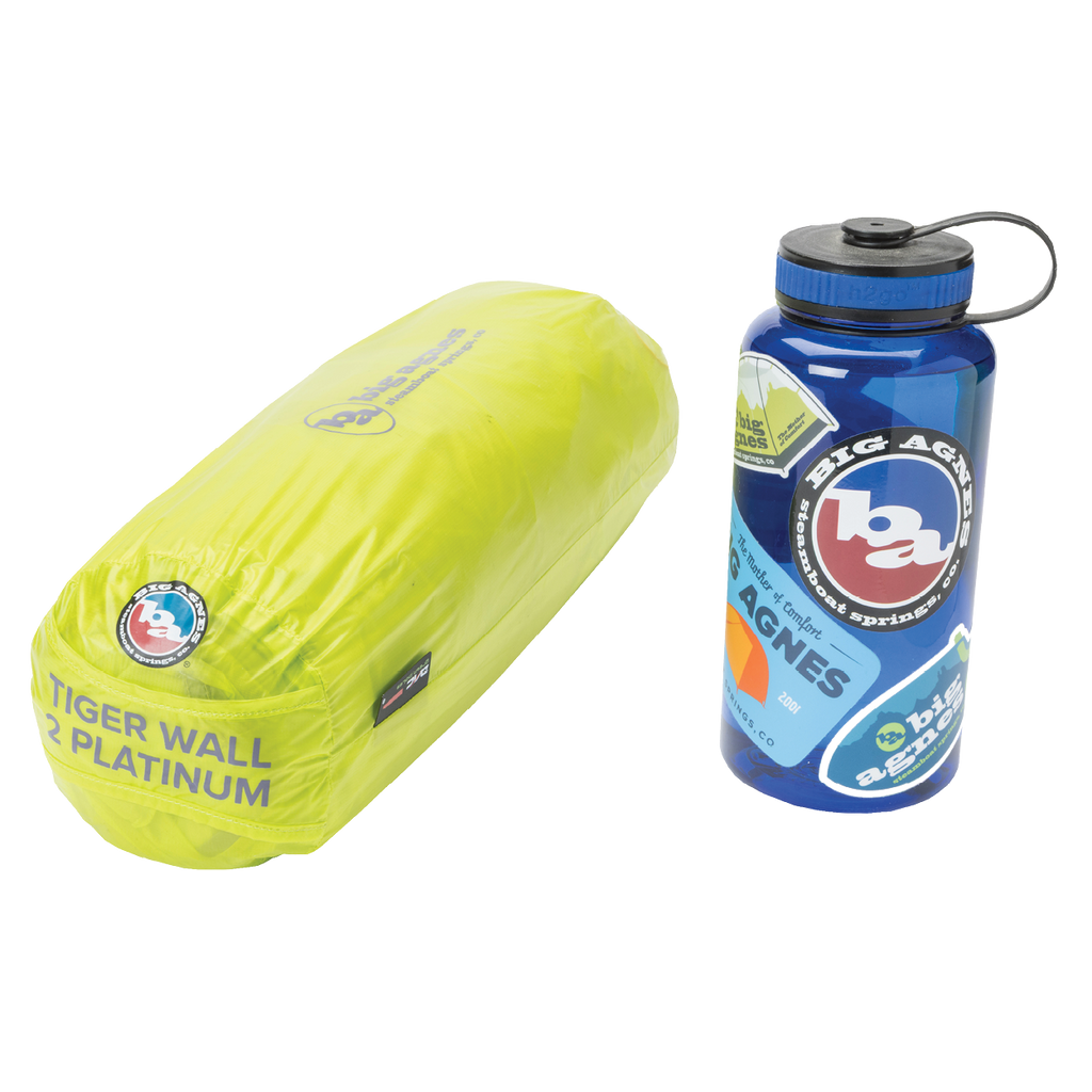 Yellow cylindrical product labeled 'Tiger Wall Platinum' and a blue water bottle with 'Big Agnes Returns' branding on a white background.