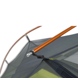 Close-up of a Tiger Wall UL2 Bikepack tent with an orange pole and gray fabric on a white background