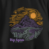 The W's Cosmic Sky T-Shirt by Big Agnes features a limited edition mountain scene with a river, trees, and swirling yellow-orange sun and clouds in purple, yellow, and gray on black, with “Big Agnes EST. 2001” below.