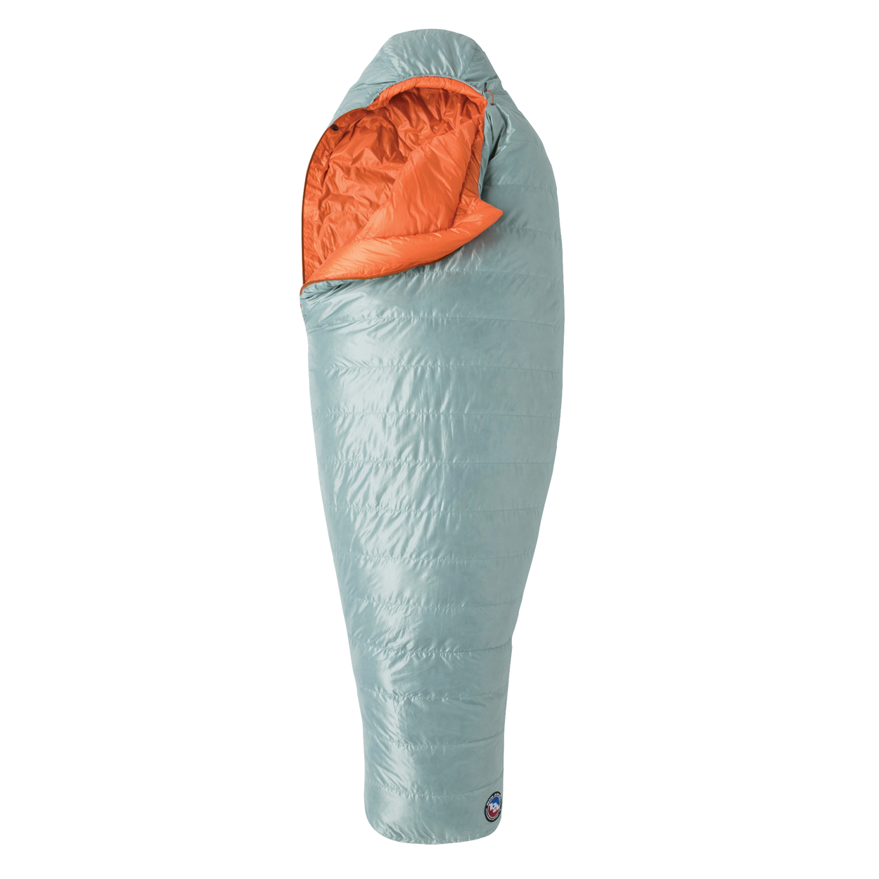 The Big Agnes Women's Greystone 30° sleeping bag in light blue, featuring DownTek insulation, stands upright against a white background. Its mummy-style hood is slightly open, showing the bright orange interior lining.