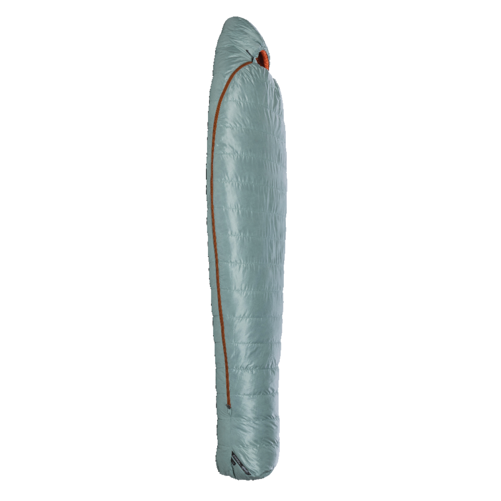The Big Agnes Women's Greystone 30° sleeping bag, in light blue with DownTek insulation and a diagonally placed orange zipper, stands upright in a mummy-style shape against a plain white background.