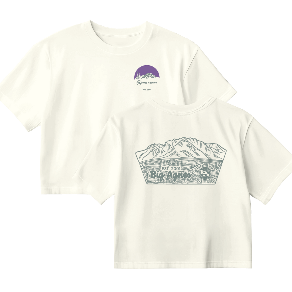 White t-shirt with mountain graphic and 'Big Agnes Returns' branding on a white background