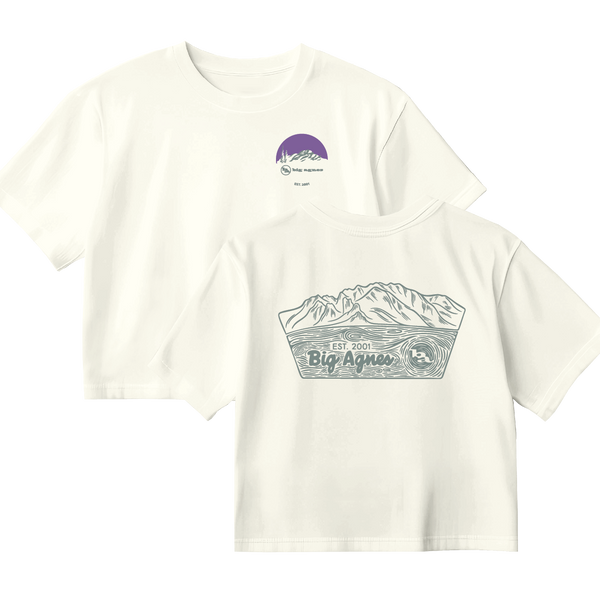 White t-shirt with mountain graphic and 'Big Agnes Returns' branding on a white background