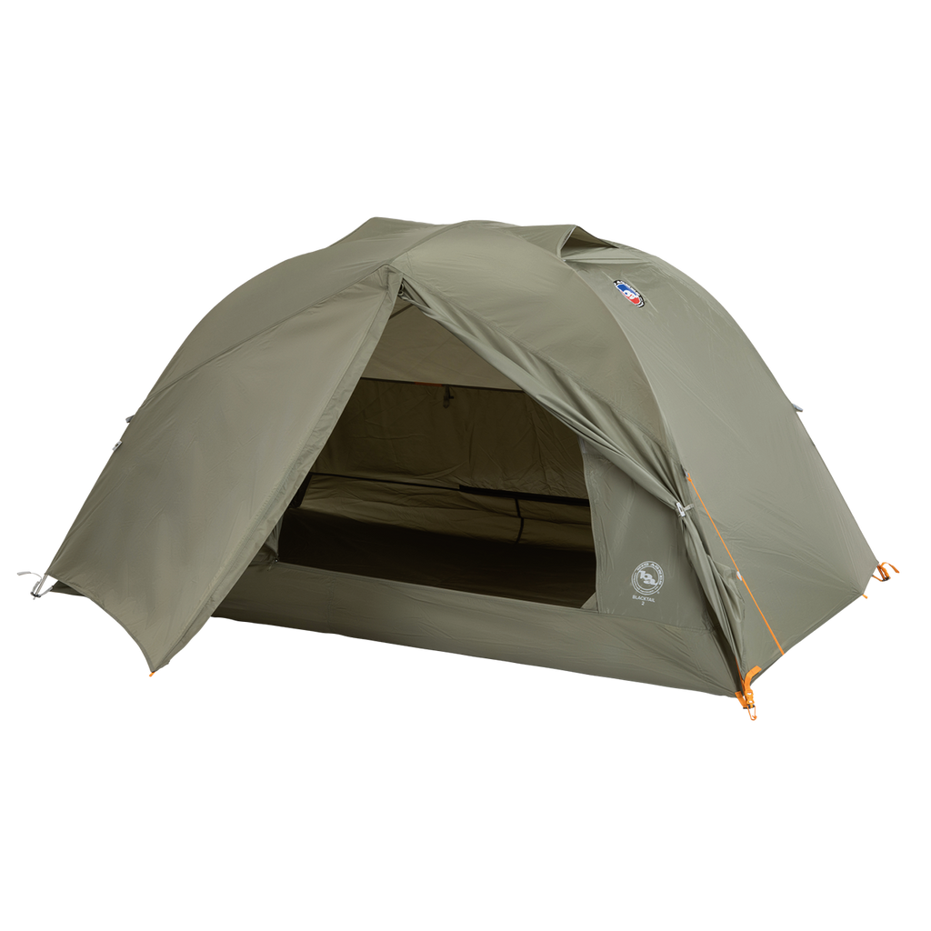 A green, dome-shaped Big Agnes Blacktail 2 - Vetiver tent is pitched with its front entrance open to reveal the interior. This lightweight backpacking tent stands on a plain white background.