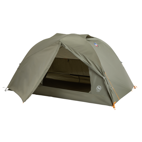 A green, dome-shaped Big Agnes Returns Blacktail 2 - Vetiver tent is pitched with its front entrance open to reveal the interior. This lightweight backpacking tent stands on a plain white background.